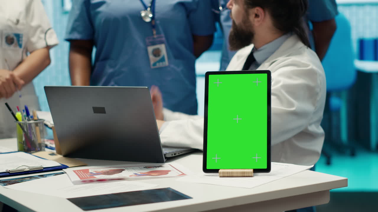 Medical professionals using technology in a healthcare setting