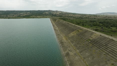 Concrete-dam-dyke-and-desolate-control-tower-in-Dalis-Mta-reservoir