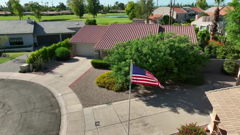 American-flag-waving-in-Southwestern-style-neighborhood-in-USA