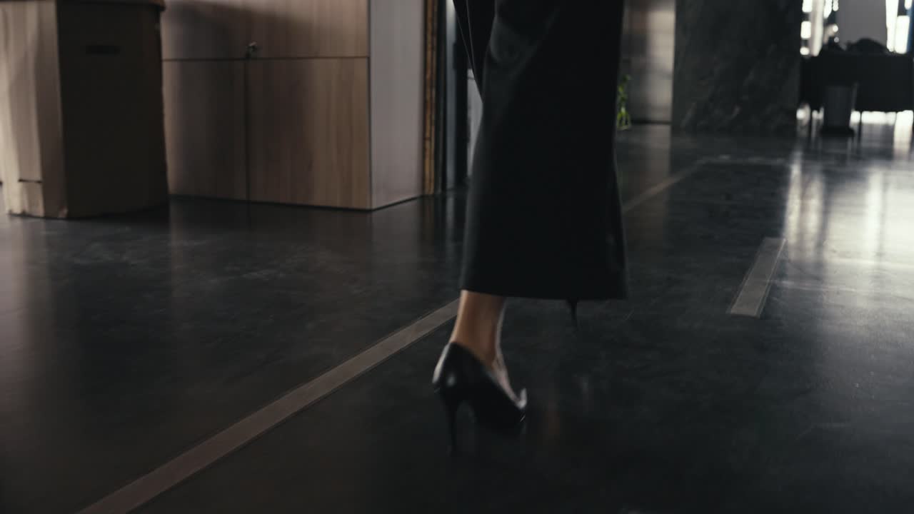 Woman walking in office with heels