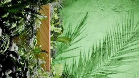 a wooden podium surrounded by tropical green foliage with palm leaf shadows on green textured wall. minimalist product display template. summer and nature concept. wallpaper.copy space. vertical