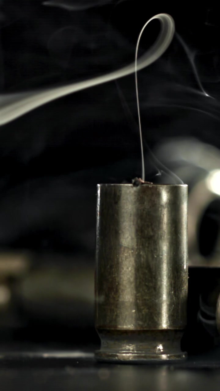 Dramatic Slow Motion of Smoke Rising from a Bullet Casing