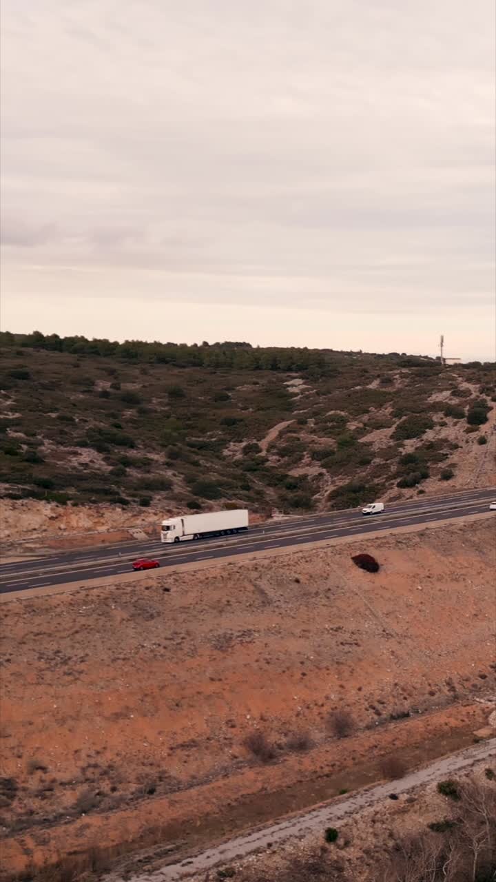 Highway Landscape with Trucks and Cars