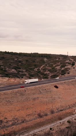 highway landscape with trucks and cars