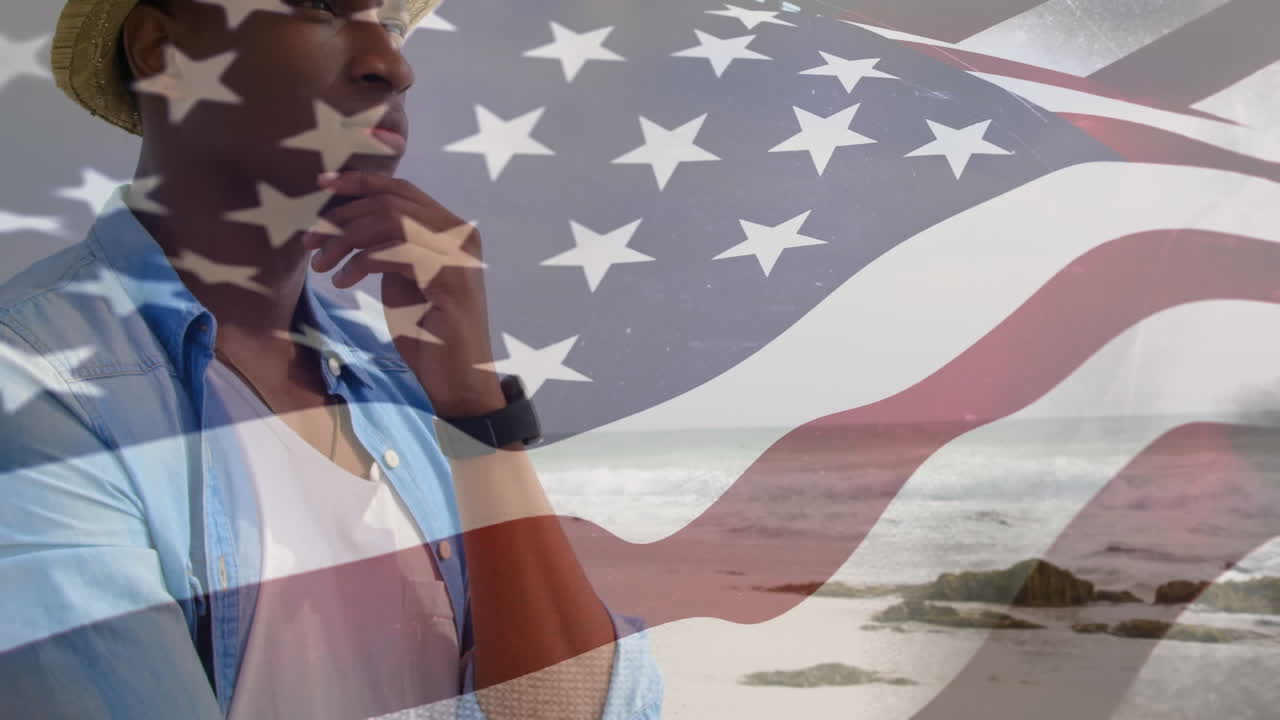 animación de un hombre afroamericano por el mar sobre la bandera de los estados unidos