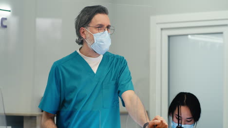 doctor and patient consultation with protective measures