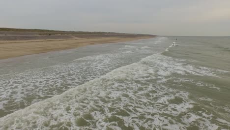 aerial: an overcast day at the sand beach between domburg and westkapelle, the netherlands