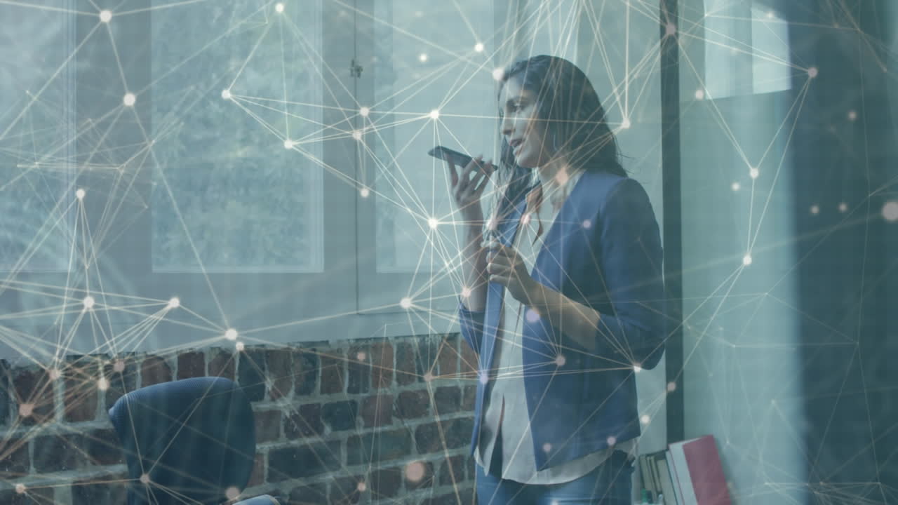 animación de una red de conexiones a través de una mujer de negocios biracial usando un teléfono inteligente