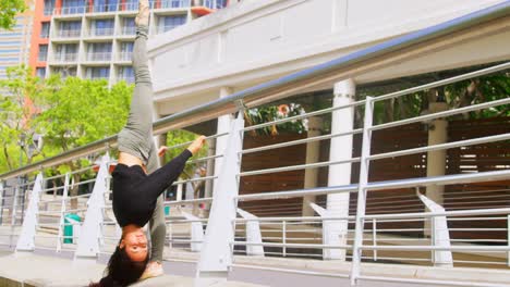 female young dancer practicing dance on the bridge 4k