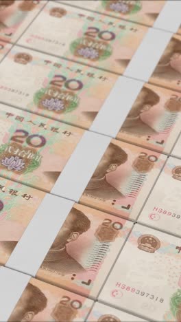 vertical video of 20 chinese renminbi banknotes printing by a money press