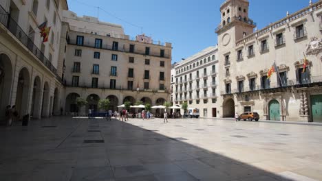 alicante’s bustling city square features historic architecture, including the grand city town hall. with lively crowds, it captures the vibrant energy and rich cultural heritage of the city.