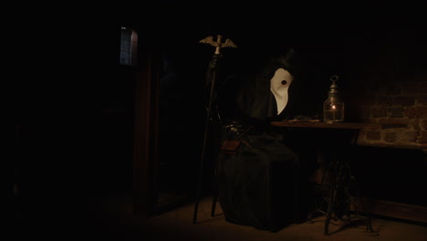 plague doctor in a dark room