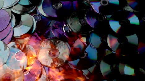 compact discs melt under the powerful hot flame of fire