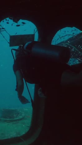 scuba diving exploration of a shipwreck
