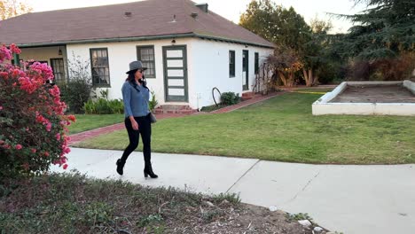 hispanic female walking on historic grounds at rancho camulos museum