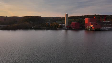 Drone-side-pan-of-a-factory-on-the-water