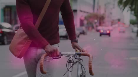 animation of shapes moving over senior african american man walking with bicycle