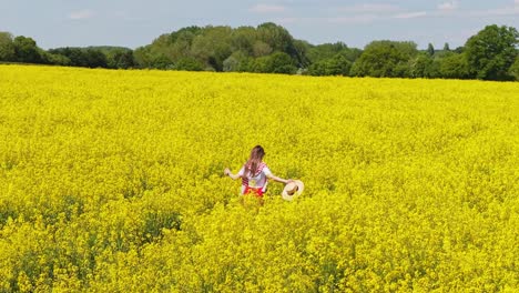 a woman strolls peacefully through a vibrant, flower-filled meadow on a sunny spring day, surrounded by nature’s colors and beauty