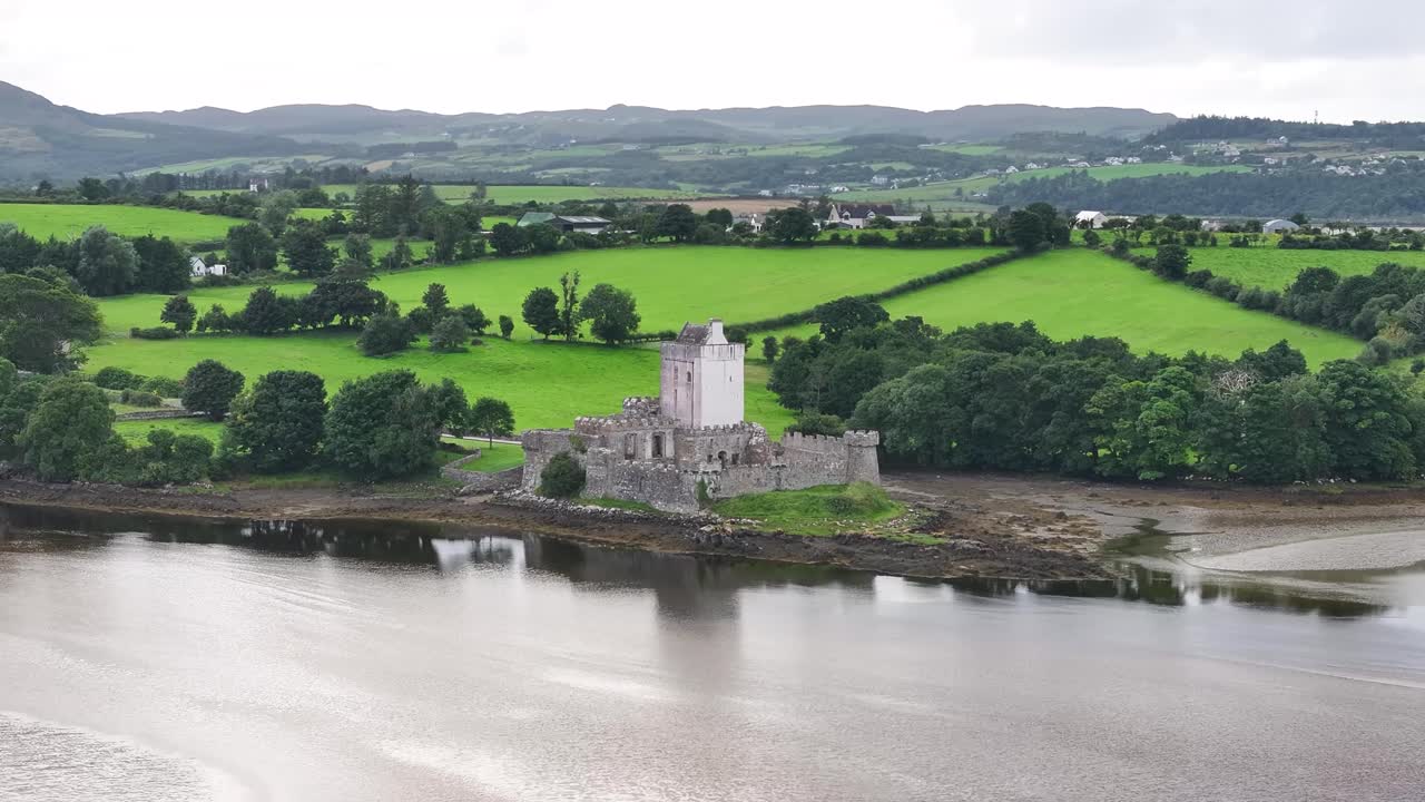 Aerial of Doe Castle with Donegal scenic landscape, rural Ireland. Historical landmark