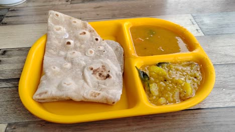 capati, served with two delicious gravies, makes for a perfect breakfast. this traditional flatbread offers a satisfying and flavorful start to your day.