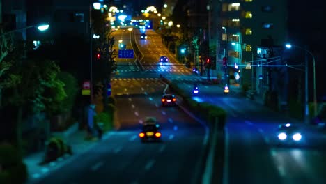a night timelapse of the miniature traffic jam at the downtown street in tokyo