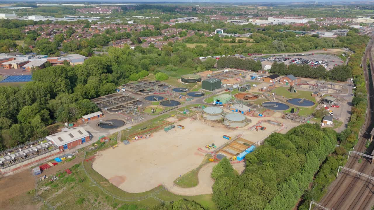 Aerial drone view of large wastewater treatment plant removing contaminants in England UK