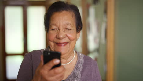 senior, smile and phone of an elderly woman