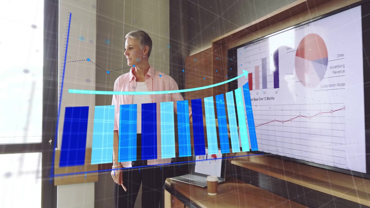 Lead pointing and casting 3D bar projection while member taking tablet, business team noting trend