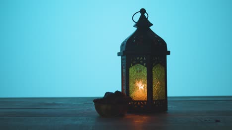 tracking shot of a hand taking water and dates during dusk ramadan celebrations