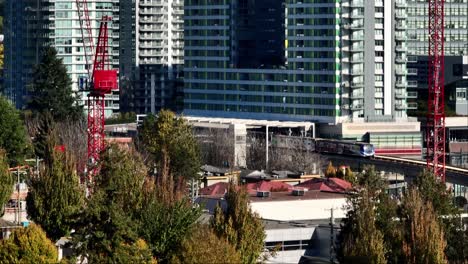 skytrain leaving marine drive station in vancouver, canada