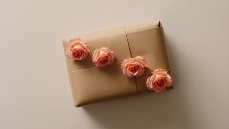 Gift Wrapped in Brown Paper with Pink Roses