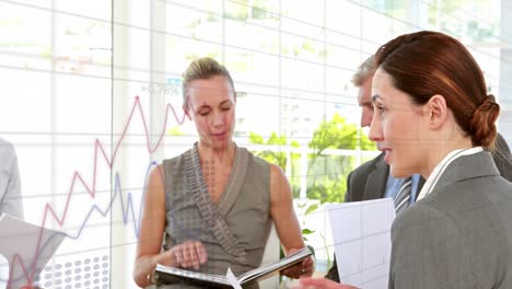 animation of statistical data processing over diverse businesspeople discussing together at office