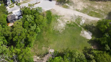 Aerial-track-through-a-razed-area-that-use-to-be-Bluffton-School-in-Muskegon