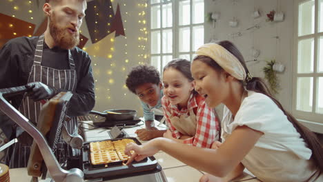 excited kids looking at waffles on cooking masterclass