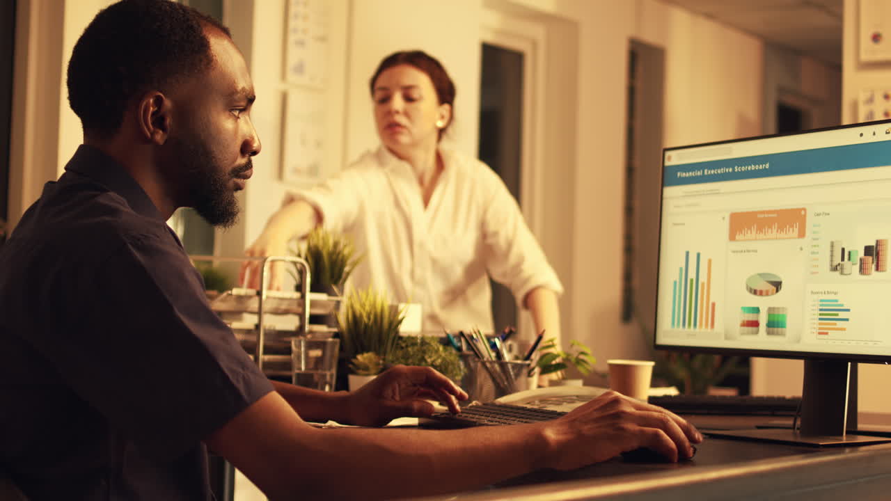 African american worker analyzing company data on computer