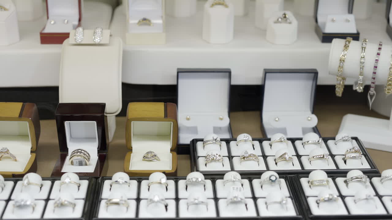 Assortment of Rings in a Jewelry Display Case, Push In