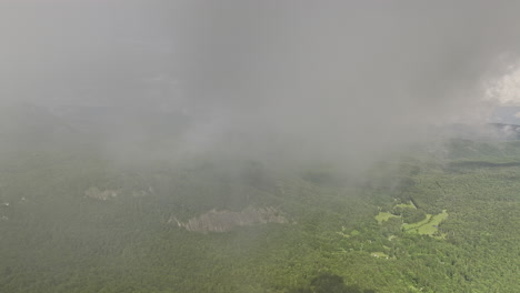 Highlands-North-Carolina-Aerial-v12-high-altitude-drone-flying-thru-misty-clouds-reveals-a-mountainous-landscape-of-natural-beauty,-adorned-with-lush-green-forests---Shot-with-Mavic-3-Cine---July-2022