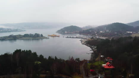 Svanesund-public-ferry-route-between-Sweden-and-Orust,-Aerial,-Establishing-Shot