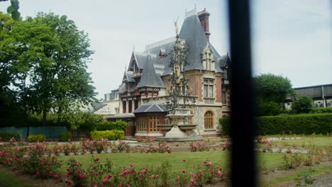 european villa with garden and fountain