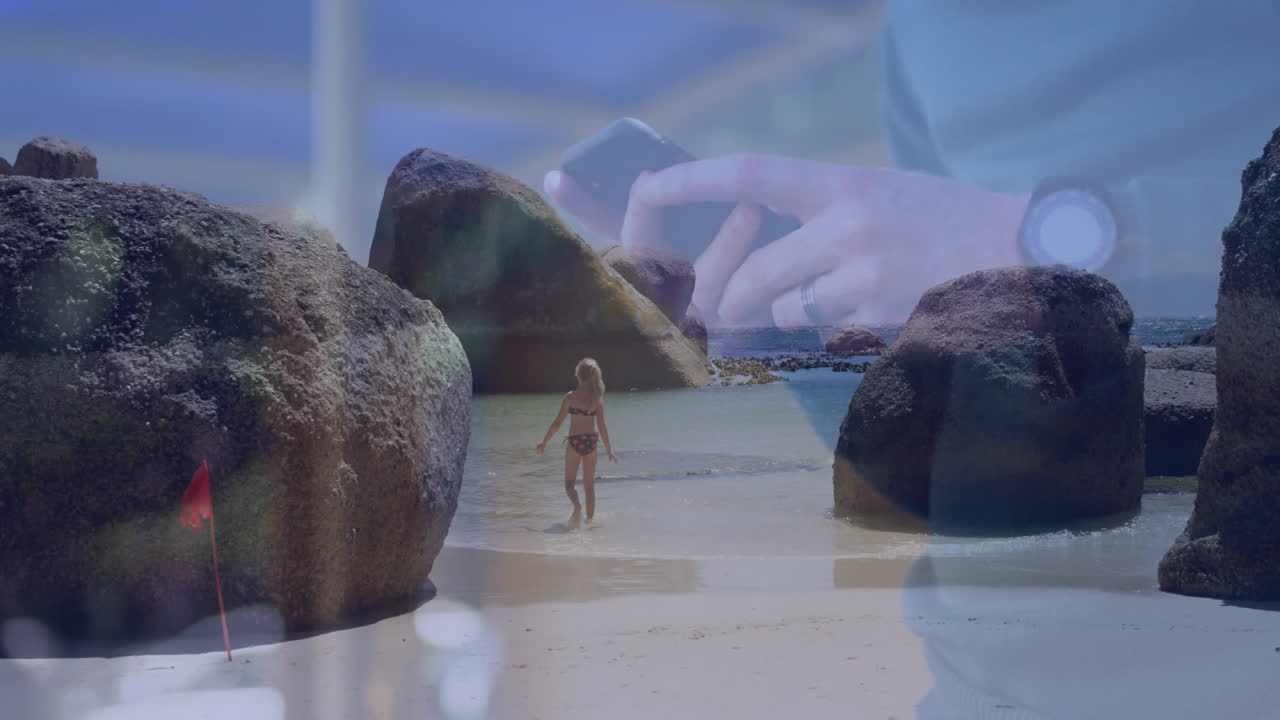 Playing with rocks on beach, child with animation of person using smartphone