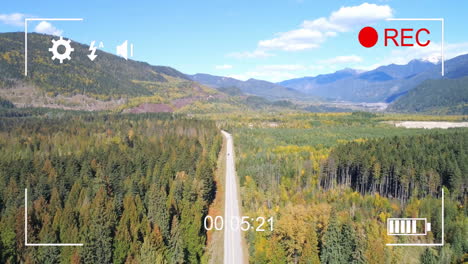 drone flight animation over scenic forest road with mountains in background