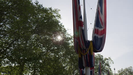 a view of union jack flags along the mall in central london, england, united kingdom