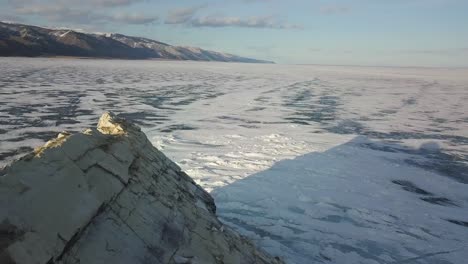 frozen lake and rocky outcropping