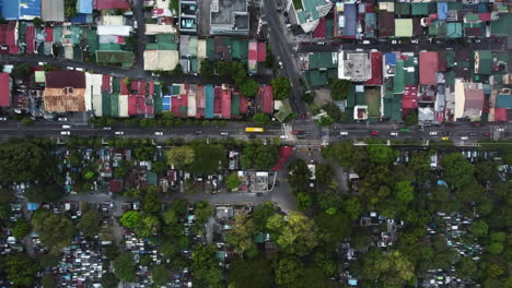 birds eye drone shot above vehicles on the south avenue of makati, philippines