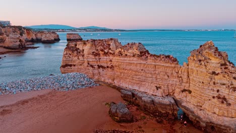 exploring the rocky coastline at sunset in portugal