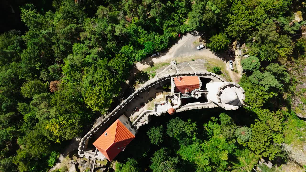 Aerial top down view over Kokorin castle fortress in green forest, Czechia