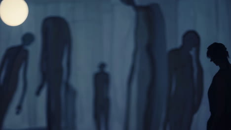 abstract figures under moonlight