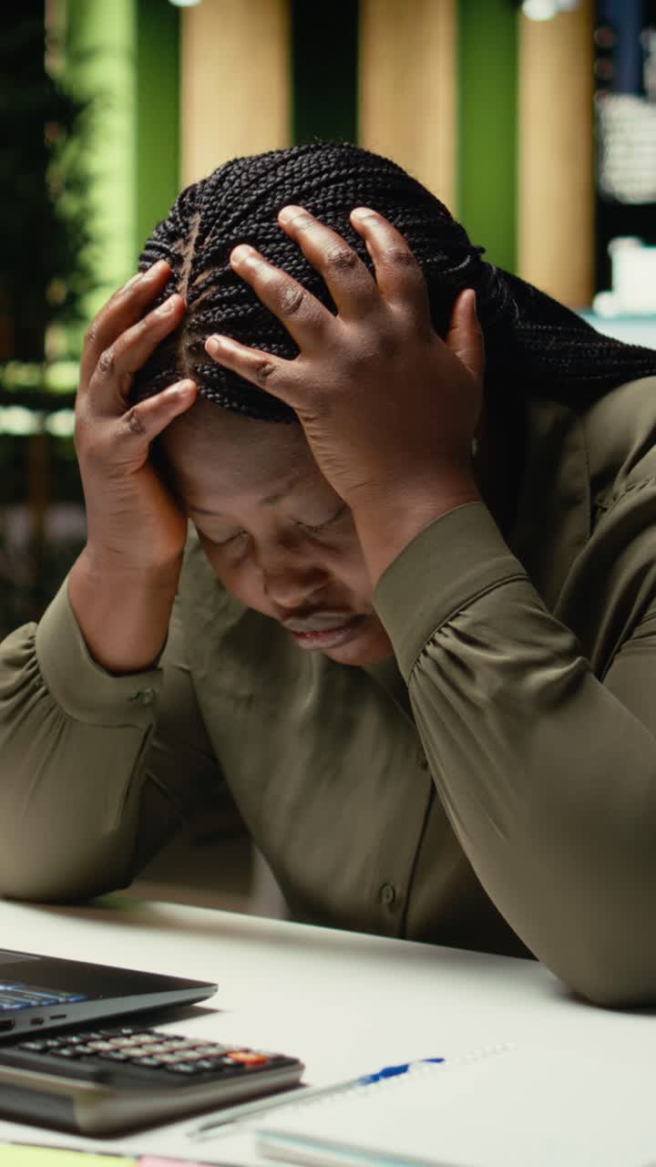 Vertical Video Black restless weary woman experiencing burnout and fatigue late at night