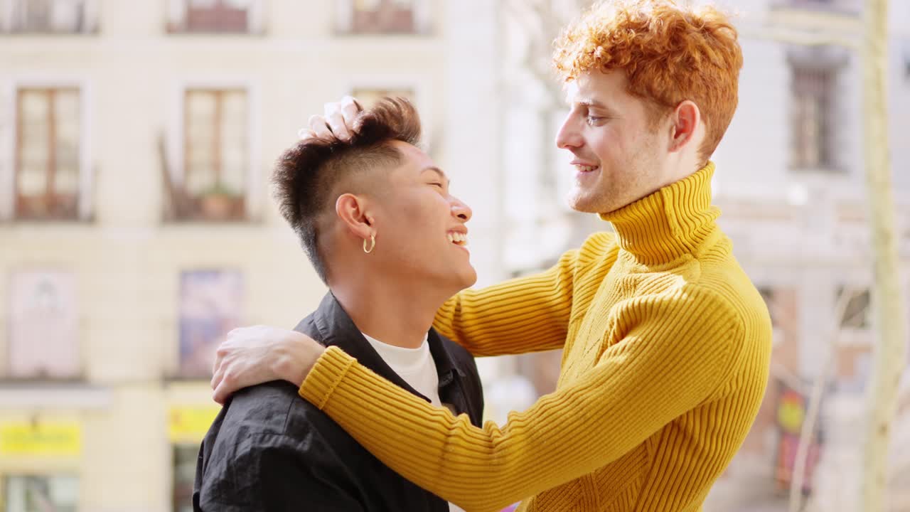 Affectionate gay couple embracing outdoors