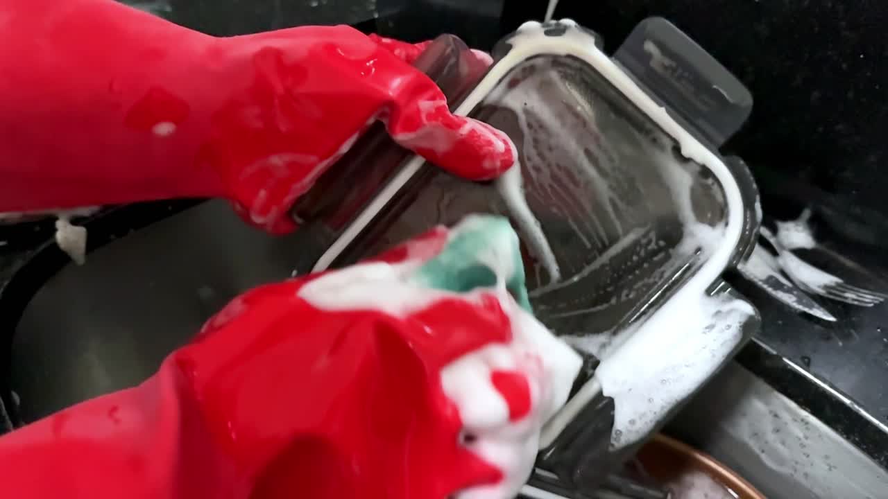 Slow motion, box lid, soapy suds, sponge, elbow-grease manual chores